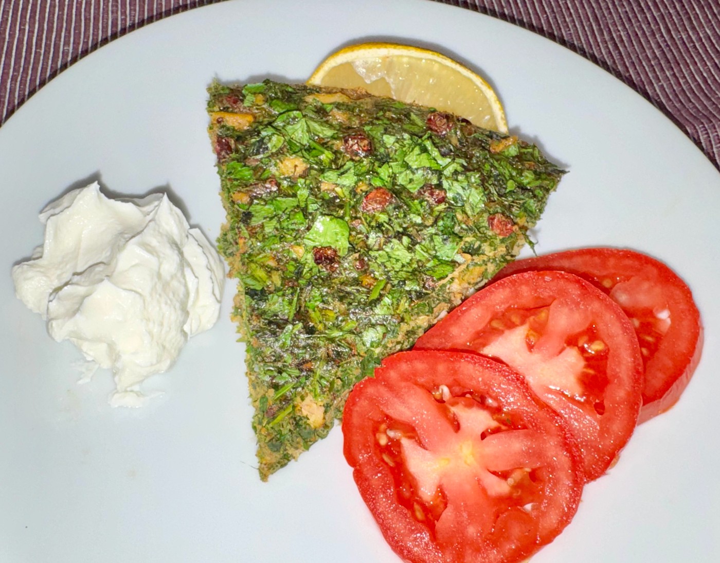 Persian kuku sabzi with smoked trout, barberries and yuzu labneh